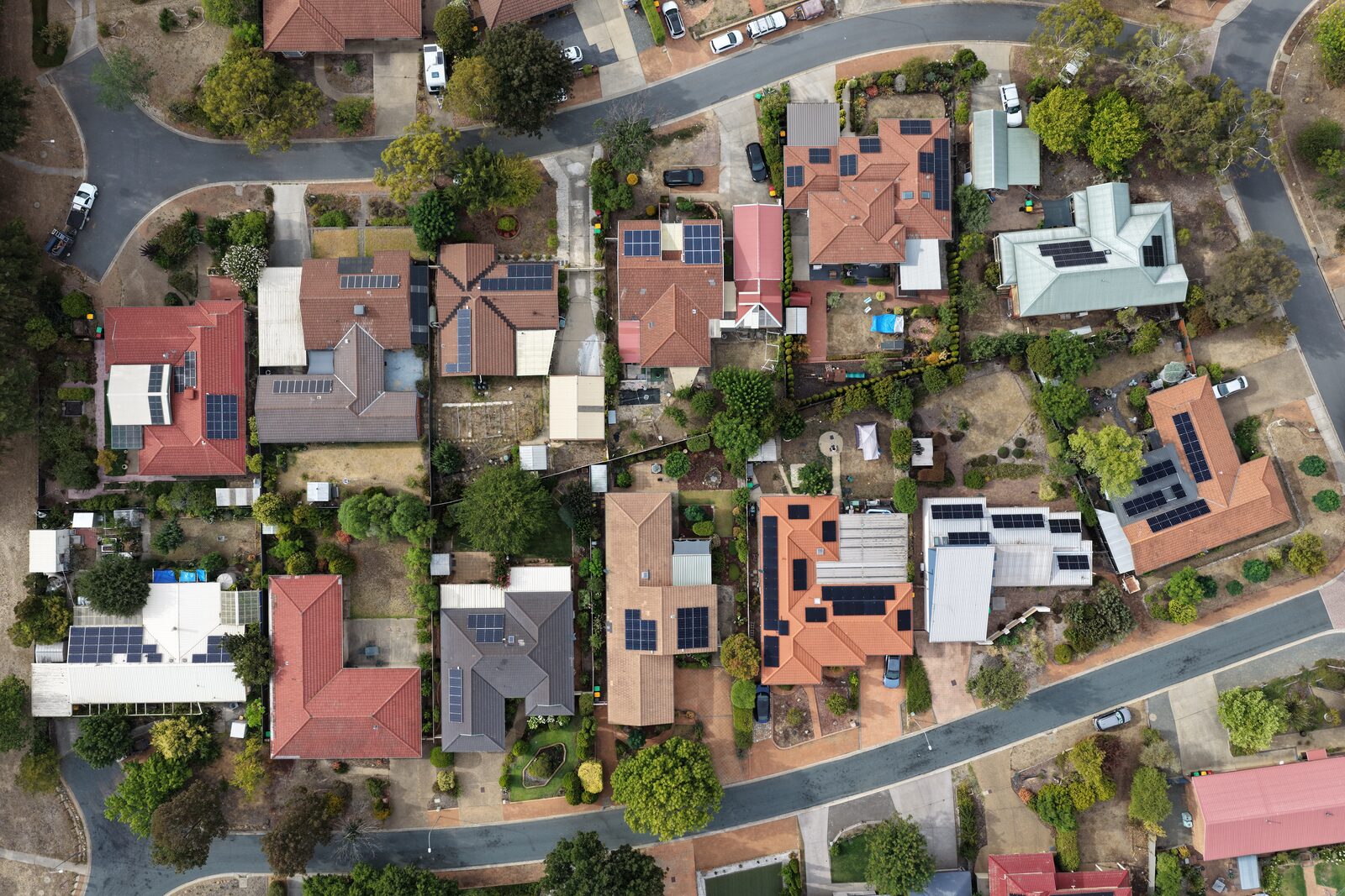 Aerial view of residential rooftops — the inspection surface roofing drone operators photograph for claims and condition reports